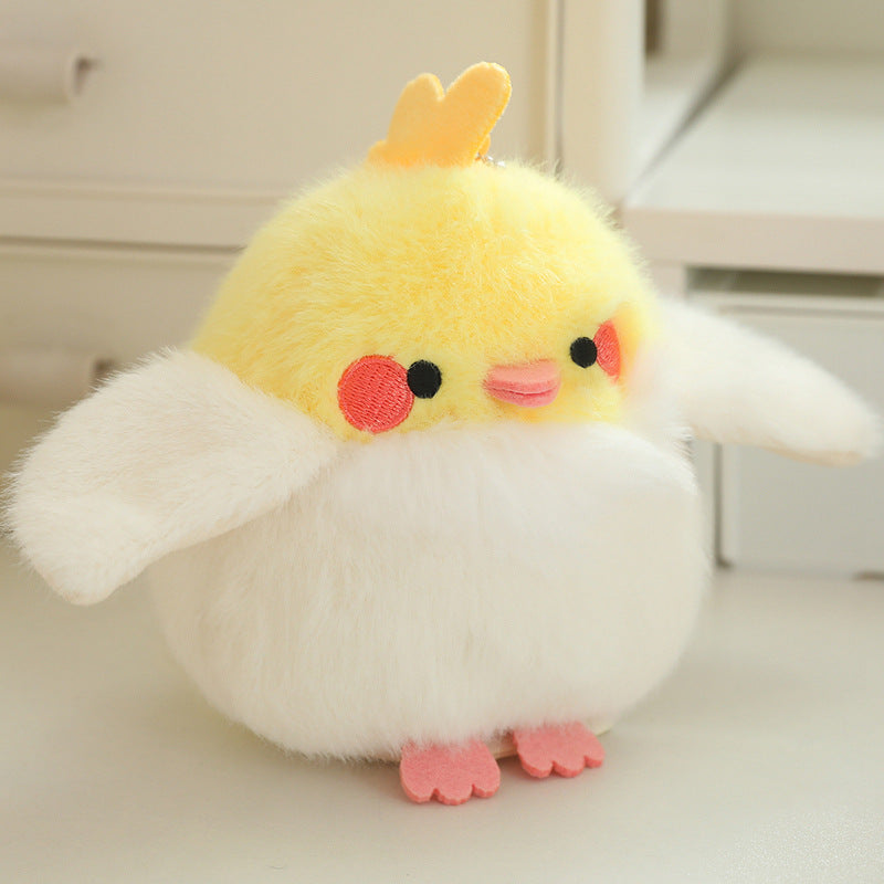 Yellow plush bird toy with red cheek circles, pink blush, and orange feet