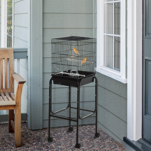 Compact black rolling metal bird cage stand with storage shelf and wire enclosure