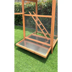 Wood bird aviary cage with slide-out tray and diagonal ramp under wire mesh