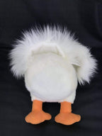 White plush pelican toy with fluffy top tuft and orange webbed feet, back view