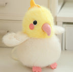 Yellow plush chick bird with pink beak, orange feet, and soft white wings