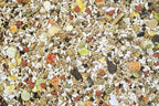 Close-up safflower blend bird seed mix with grains and mixed colored fragments