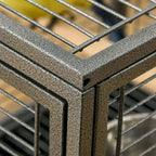 Black metal bird carrier corner frame with textured finish and wire mesh bars