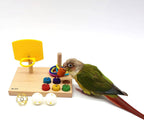 Wooden tabletop parrot activity center with yellow ring launcher, colorful rings and peg blocks