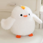 White plush bird with yellow crest and orange feet
