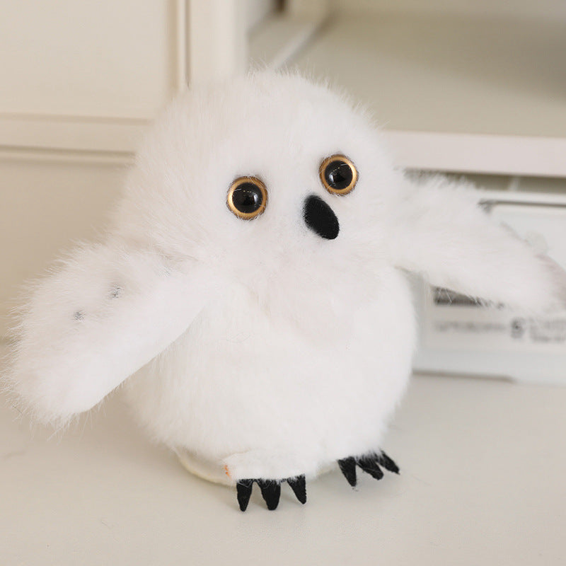 White bird plush with large golden eyes and black feet, 13 cm