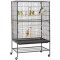 Gray rolling birdcage with two perches and lower storage shelf, on caster wheels