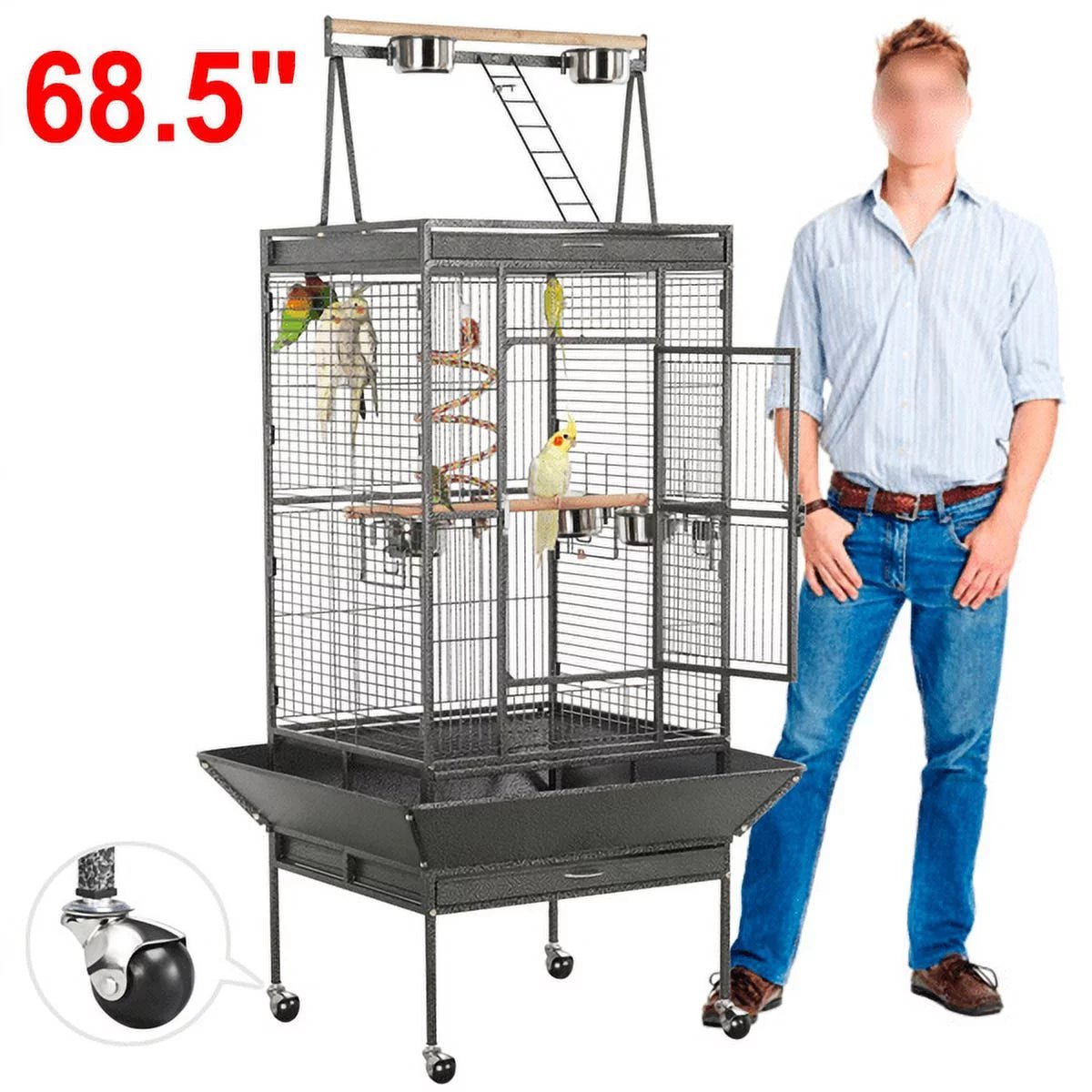 Parrot cage with open play top and wheeled base, shown with person for scale
