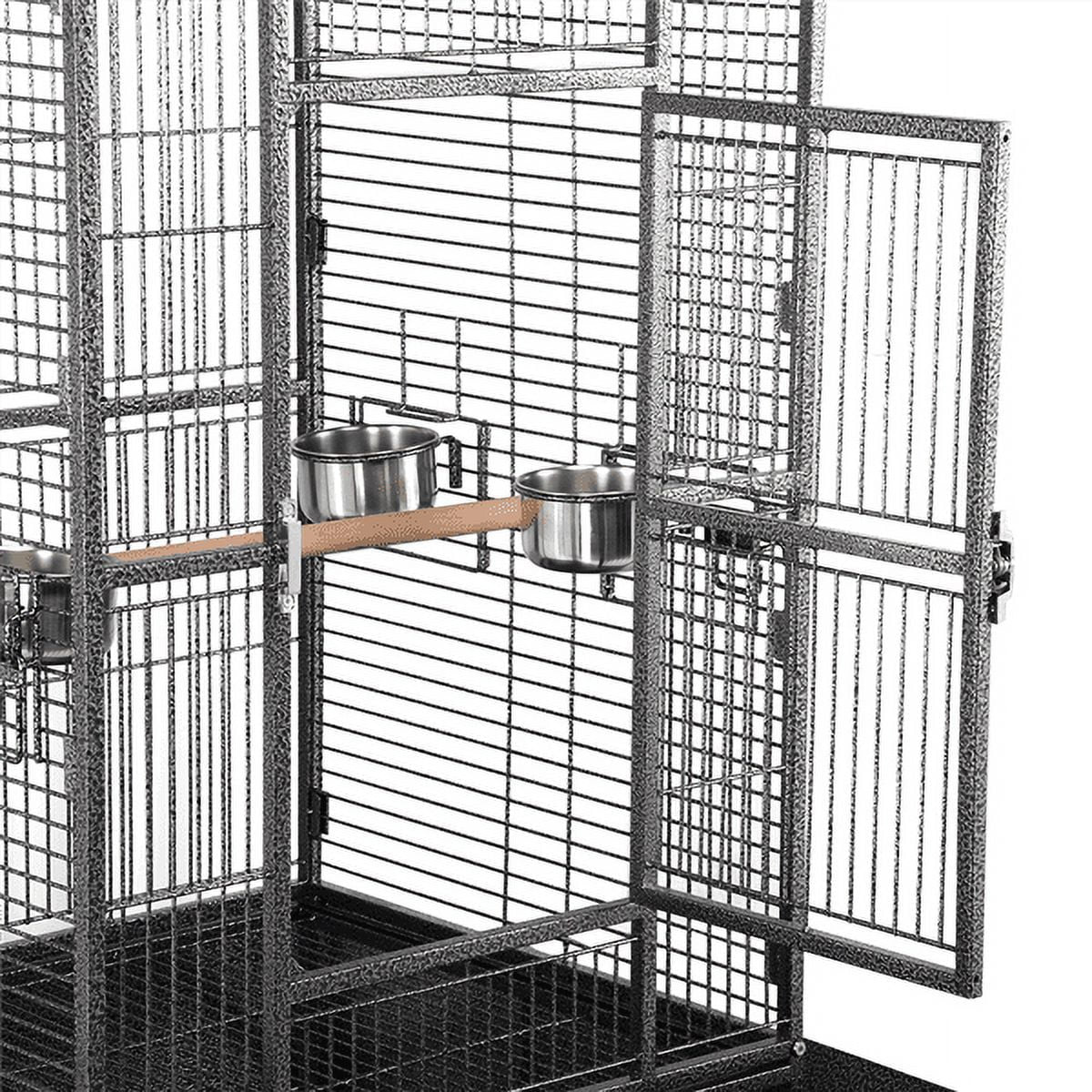 Parrot cage interior with wire panels and two stainless bowls attached to the door