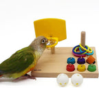 Wooden tabletop parrot activity center with yellow ring launcher, colorful rings and pegs