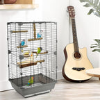 Natural wood bird perch set installed in a wire bird cage with multiple perches
