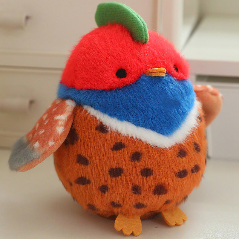 Red, blue, and brown bird plush with green cap tuft, beak, and spotted body, 13 cm