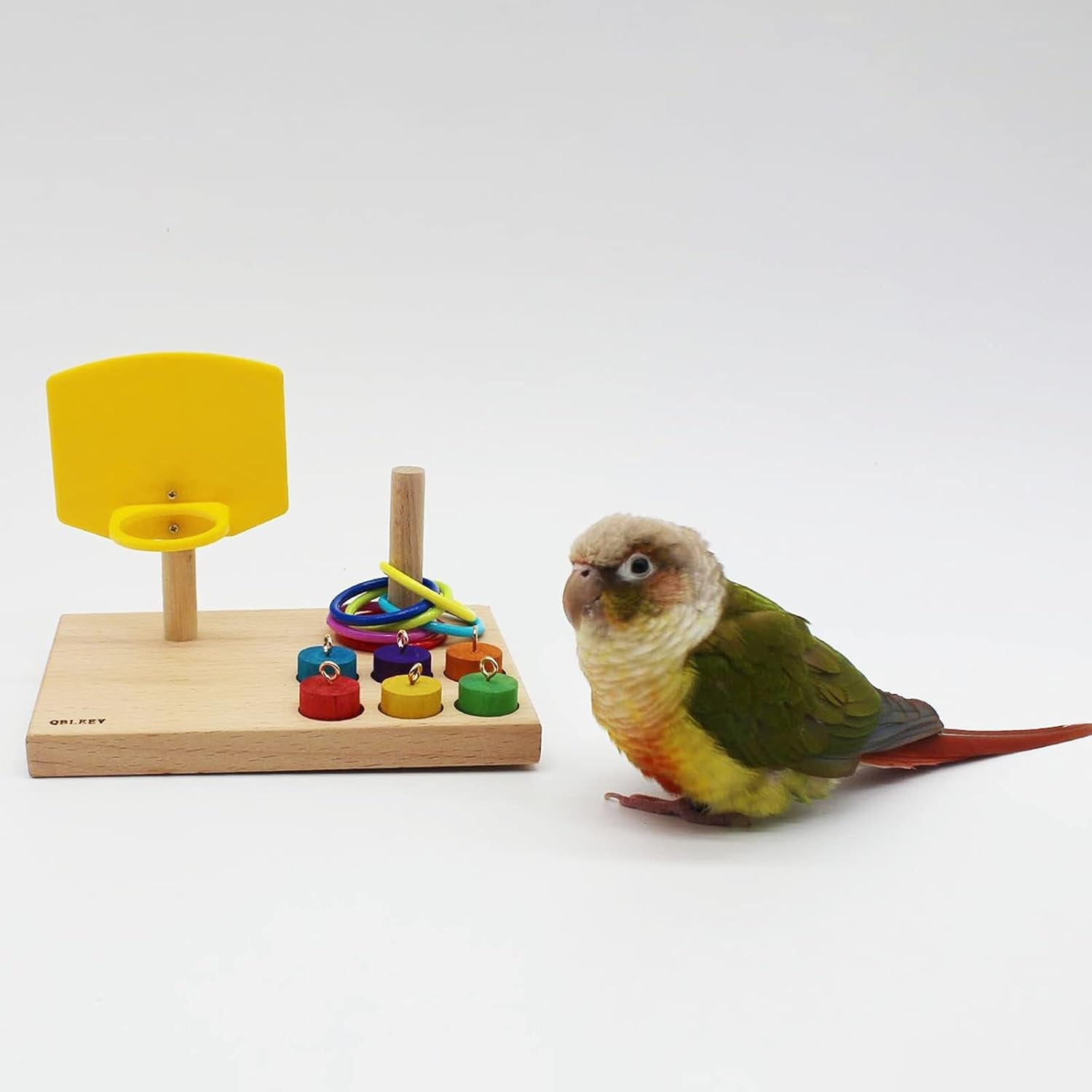 Wooden tabletop parrot activity center with yellow ring launcher and colorful rings with pegs