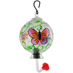 Hanging hand-painted glass hummingbird feeder with pink-and-orange butterfly and green vines