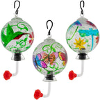 Set of three hanging hand-painted glass hummingbird feeders with different painted designs