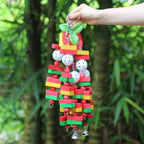 Parrot wooden foraging toy hanging on metal chain with red apple charm, green leaf, colorful blocks, bells