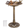 Gold pedestal bird bath feeder with wide bowl and bird figures in raised positions