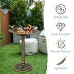 Vintage-style pedestal bird bath feeder with bird ornament and ornate round base