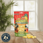Red Sunburst freeze-dried pineapple mango fruit pouch with scattered yellow pieces