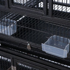 Black wrought iron bird cage close-up of divider bars and sliding bottom tray