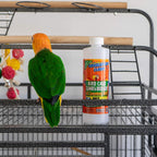 Bird cage cleaner bottle placed on a cage shelf in front of a green parrot.