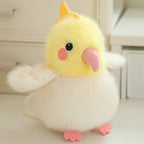 Yellow plush chick with pink beak, orange feet, and soft white wing edges