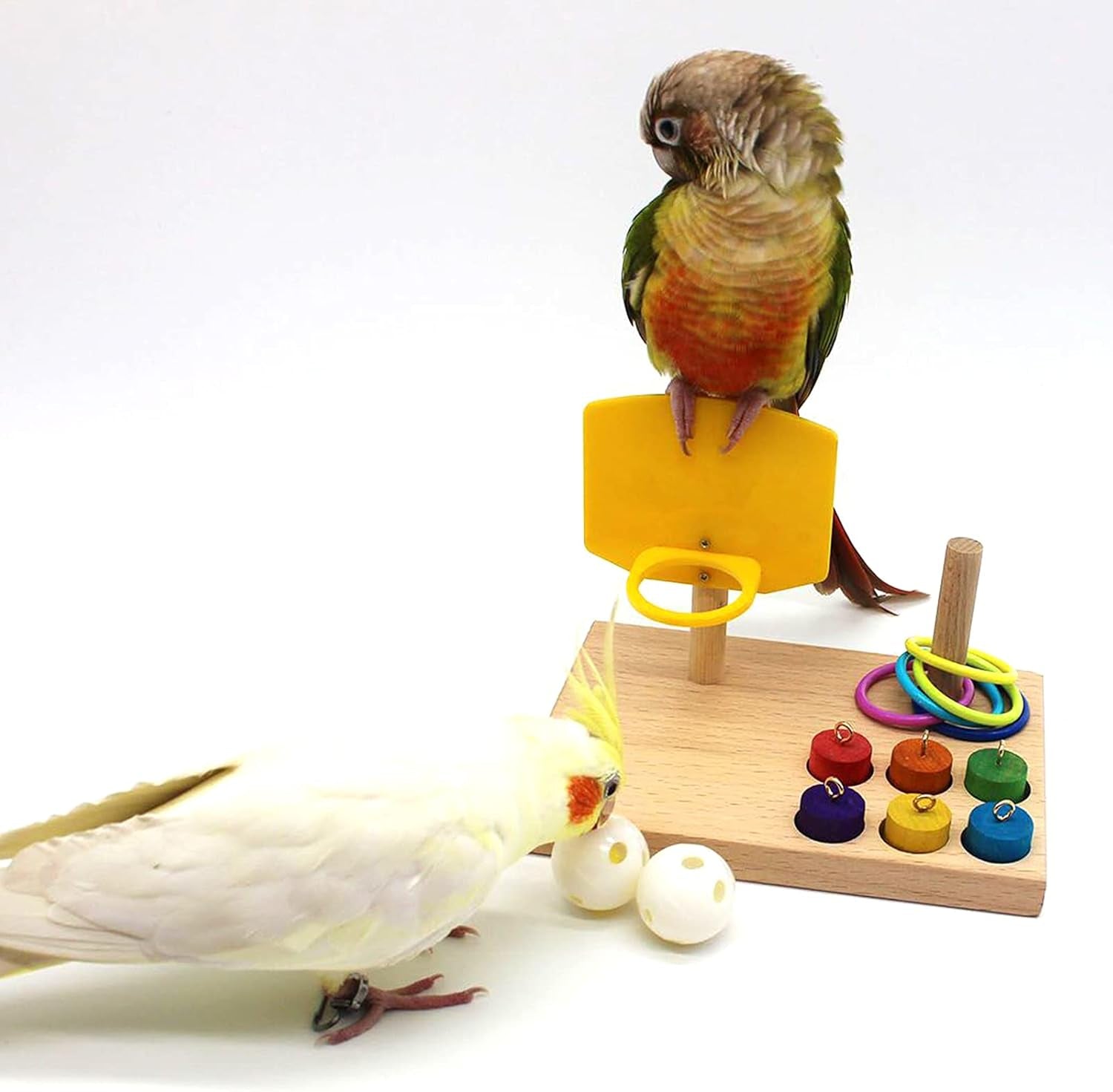 Wooden tabletop parrot activity center with yellow ring launcher, rings, peg toys, and white balls