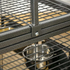 Black wrought iron cage corner joint with locking hardware and wire grid bars