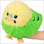Green and yellow budgie plush with blue beak, small wings, and soft fuzzy texture