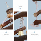 Wooden bird swing close-up with hanging metal bell and chain link details