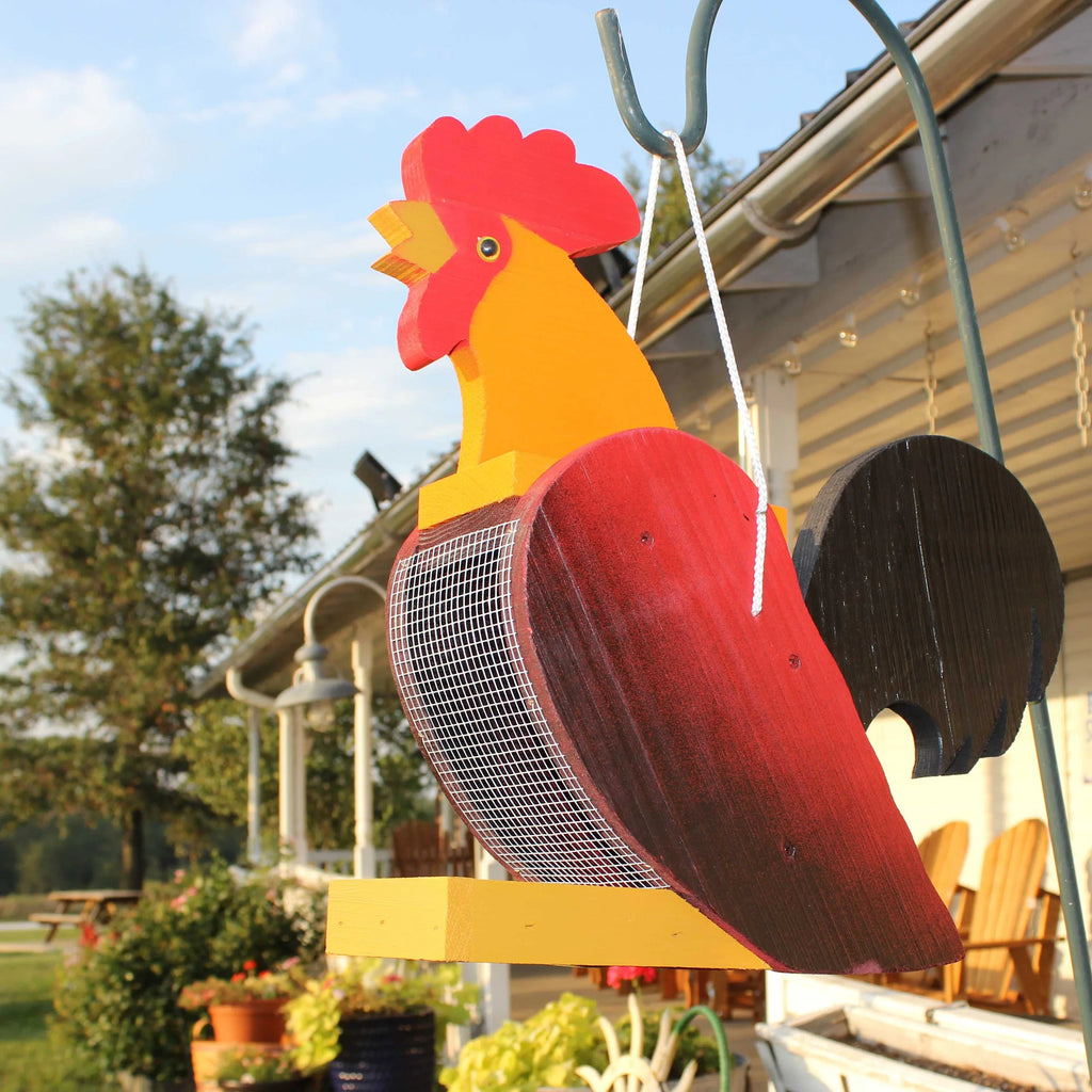 Wooden hanging wild bird feeder shaped like a colorful rooster with mesh body